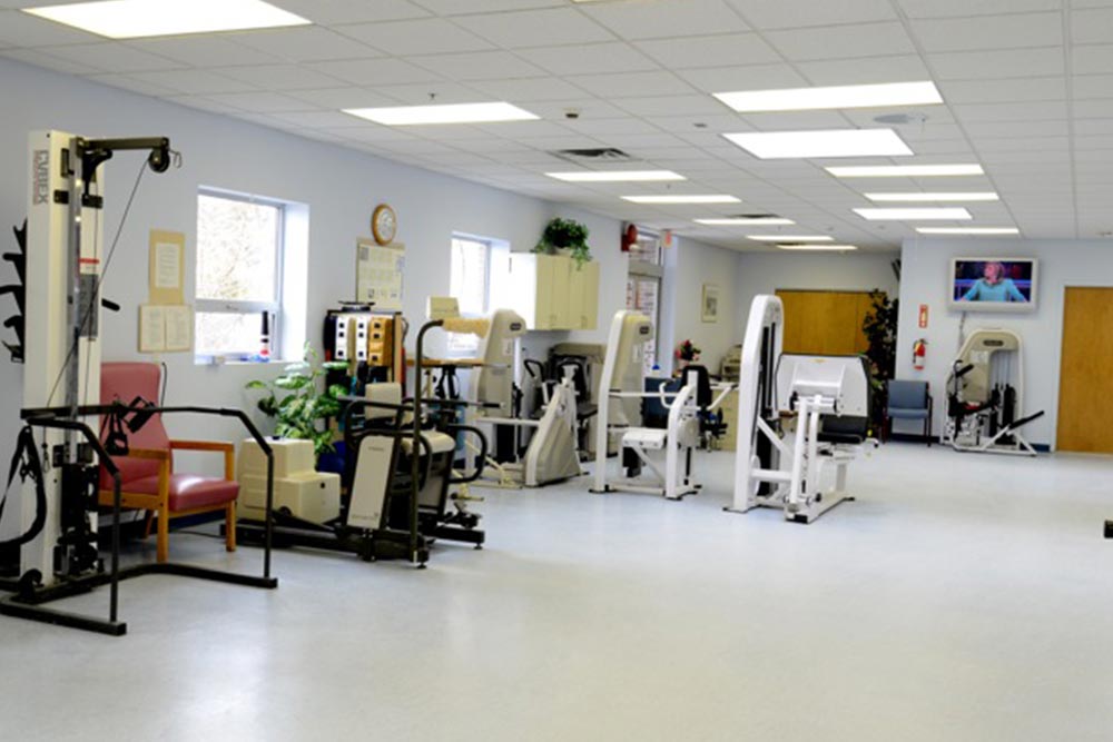 Exercise room full of physical therapy equipment at Carillon.